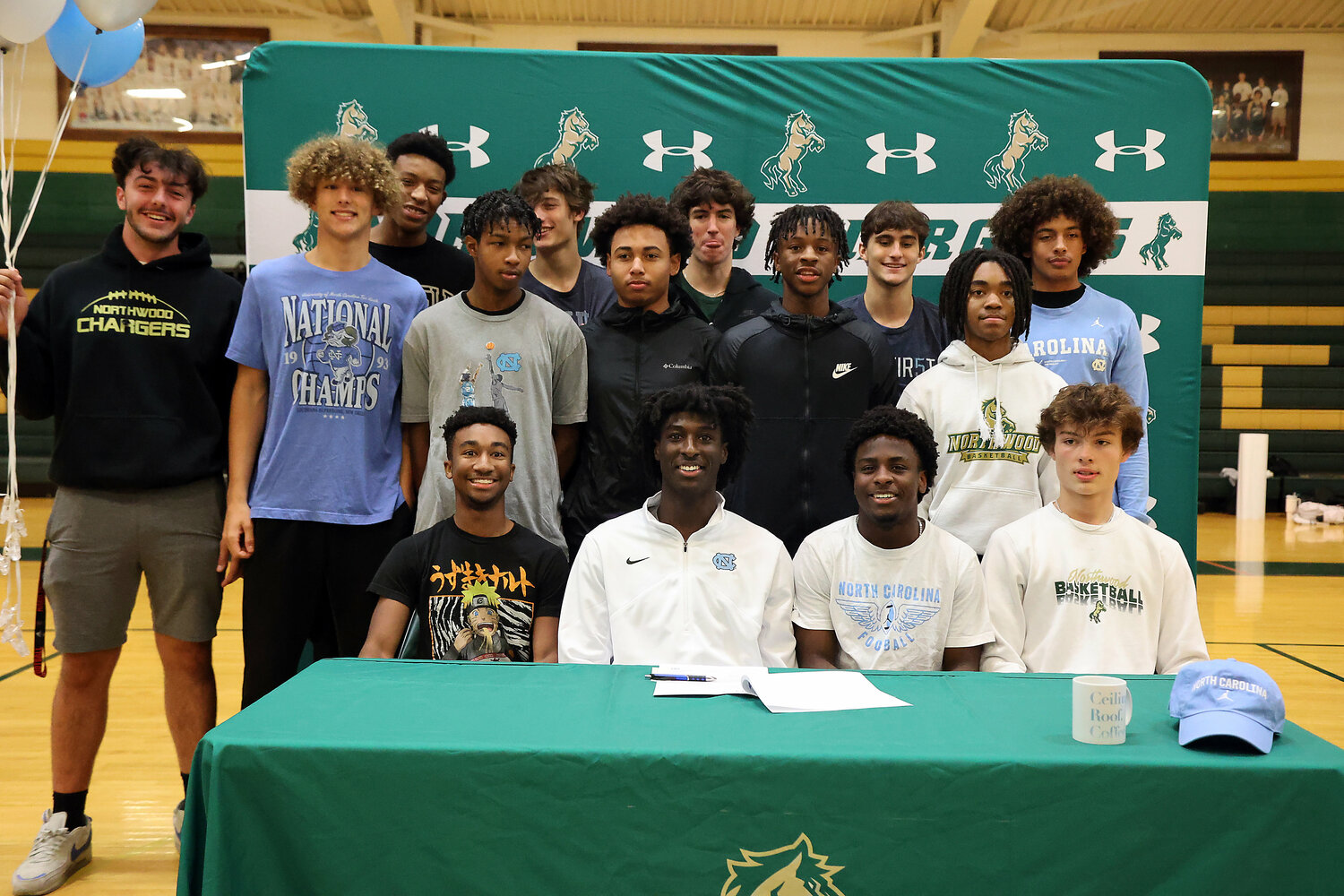 Drake Powell poses with his Northwood teammates after signing a letter of intent to play basketball at UNC.